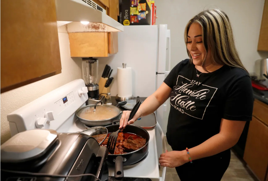 woman cooking at stove